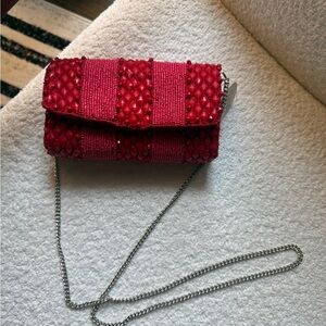 Vibrant red beaded clutch with optional silver chain. New with tags!